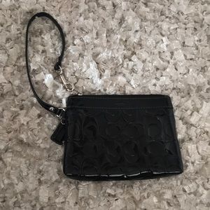 black patent leather Coach wristlet